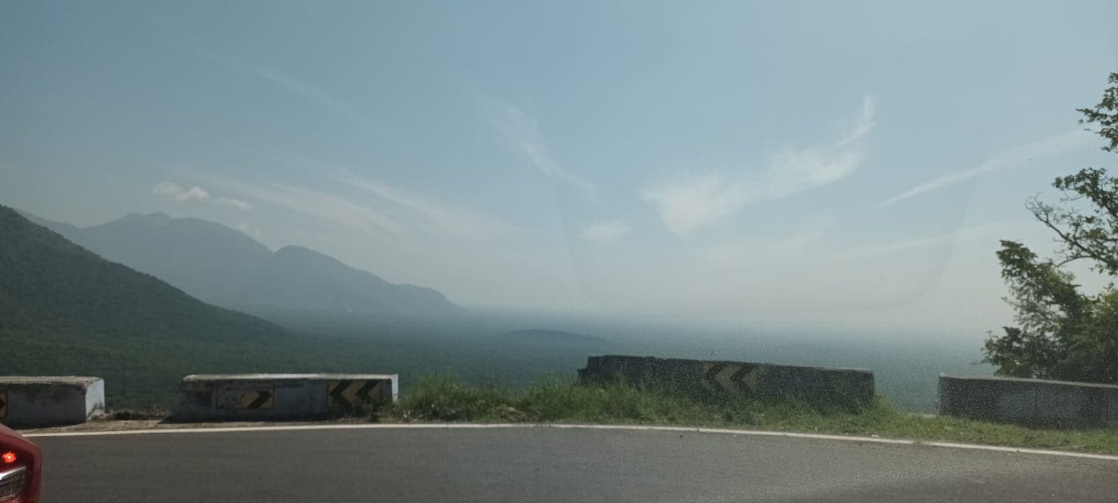 Mountain range viewed from a hairpin bend on a hill-station ghat road